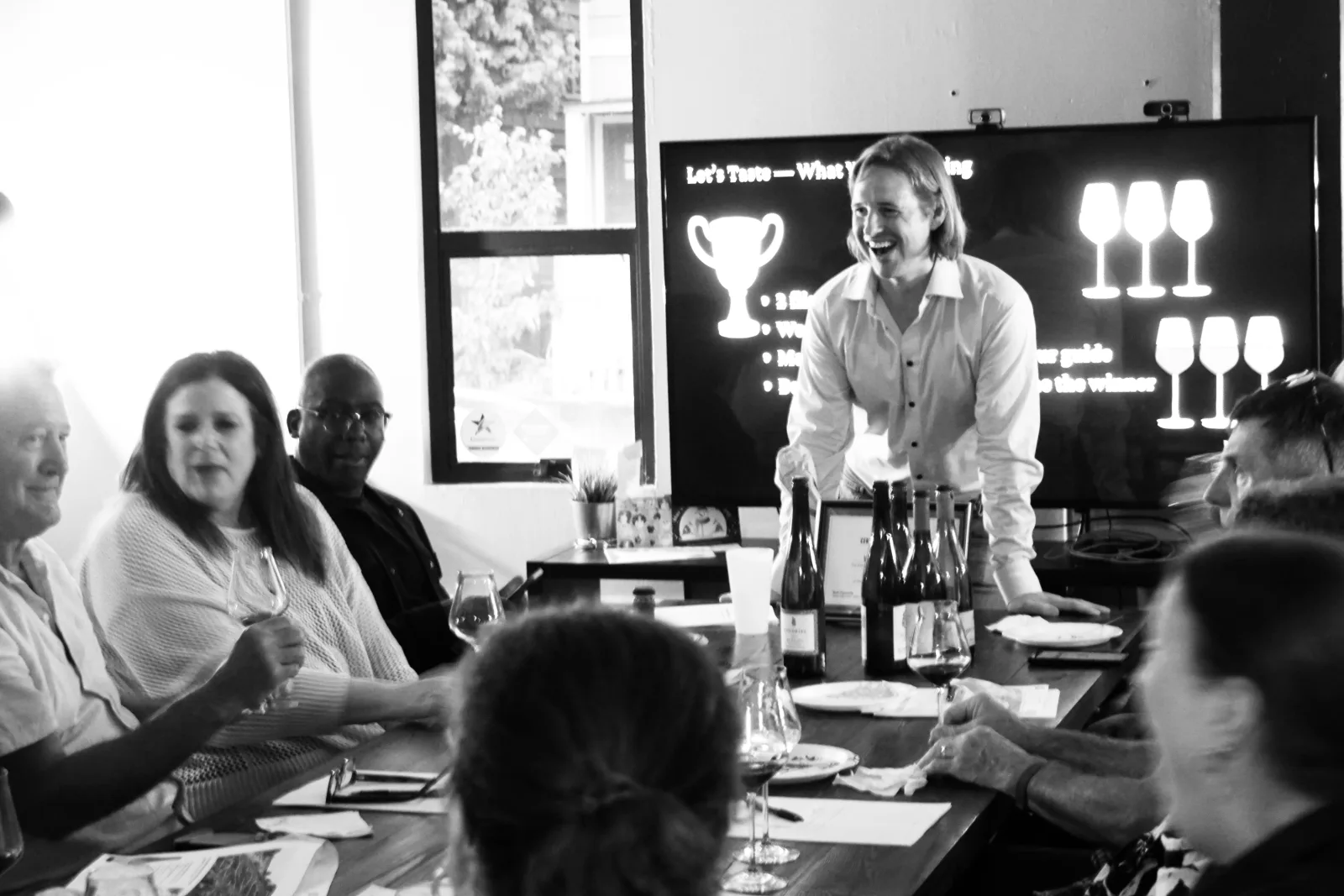 Seth Cysewski leading a guided blind wine tasting for a corporate group in Seattle