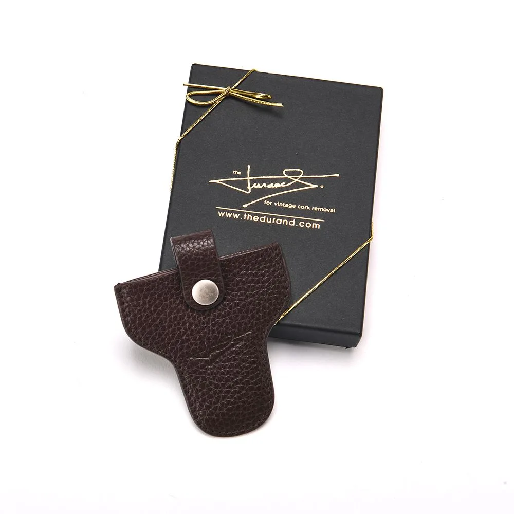 The Durand corkscrew with its box and cork stand, set: leather sheath with gift box (light-gray studio ground, not pure white)